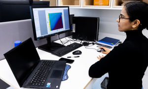 GeoEnergy LAB woman working with a computer