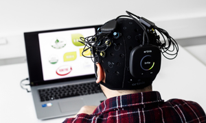 A man works with a computer at Neuro LAB